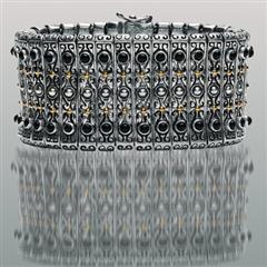 Silver gold black onyx cuff bracelet reflected.  Arista.                                                                                                                                                                                                  
