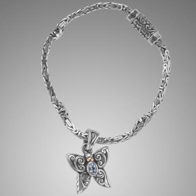 Silver byzantine bracelet with butterfly charm.                                                                                                                                                                                                           