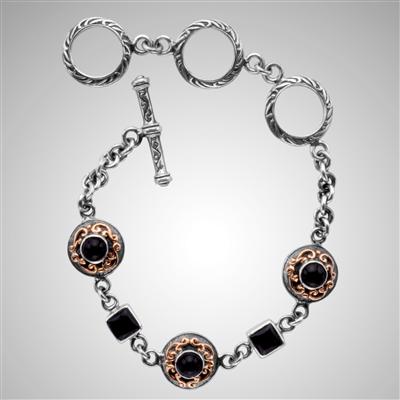 Sterling silver onyx bracelet with gold scrollwork.                                                                                                                                                                                                       