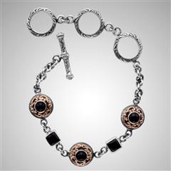 Sterling silver onyx bracelet with gold scrollwork.                                                                                                                                                                                                       