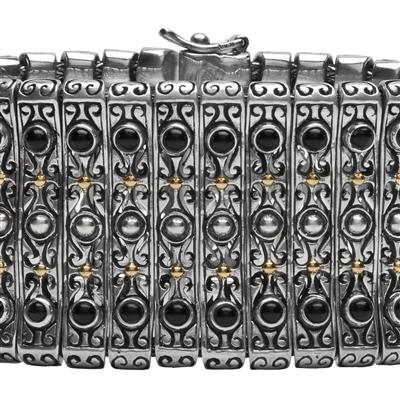 Sterling silver bracelet with black onyx cabochons and 18K gold.                                                                                                                                                                                          